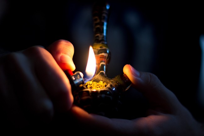 marijuana-buds-being-lit-in-a-pipe